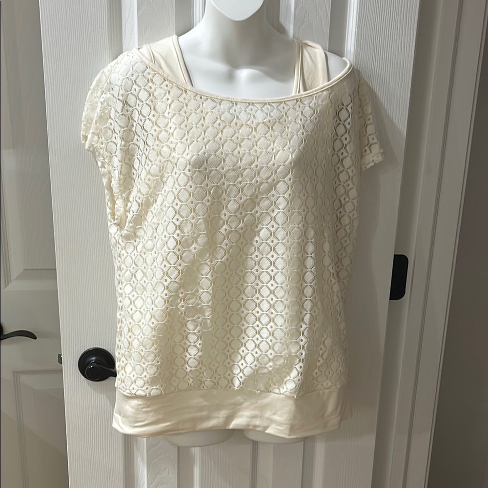 Size large two piece is attached cream color shirt new no tags